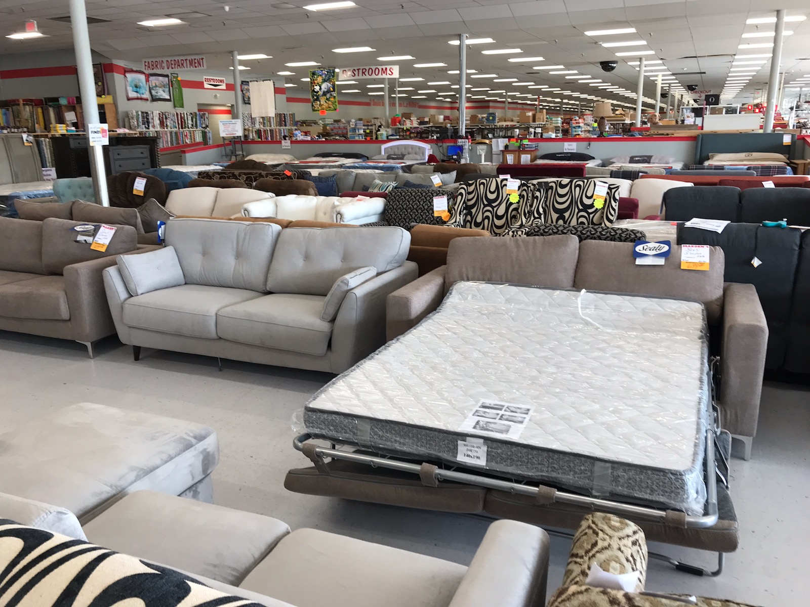 Aisles of various on sale furniture items